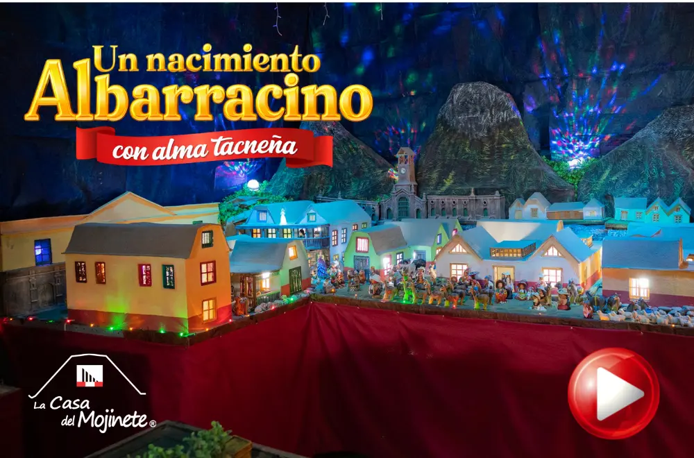 Maqueta de nacimiento albarracino con casas de mojinete en Tacna durante exposición navideña